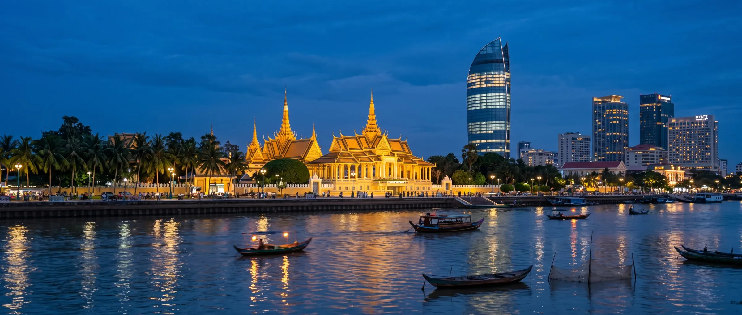 Phnom Penh riverside skyline at dusk, with the Royal Palace and modern towers